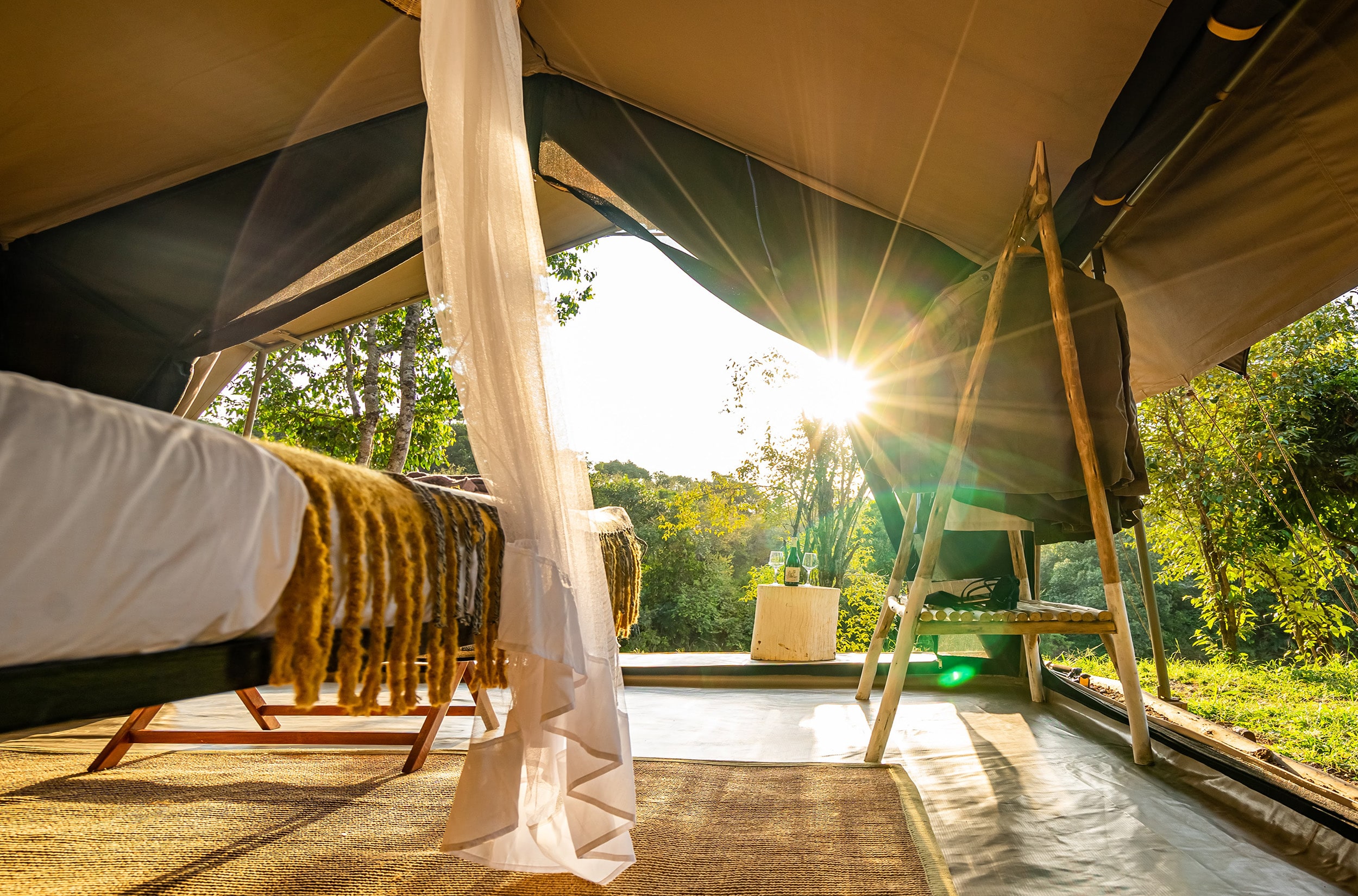A Sekenani tent opening onto the riverine forest at sunrise